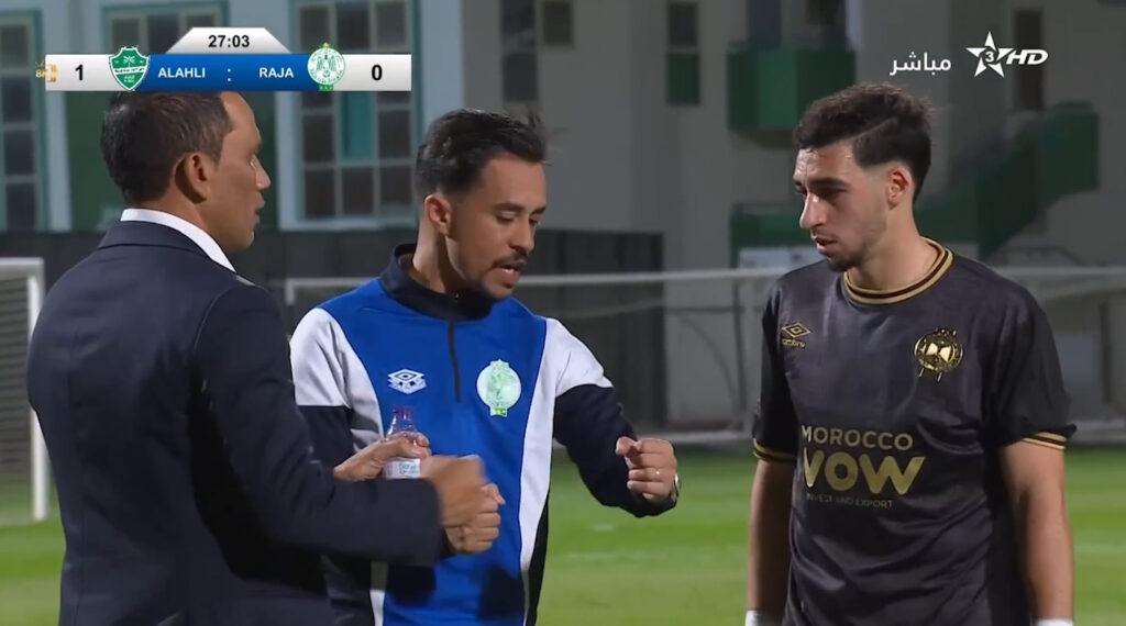 Coach Salah explaining to midfield player
